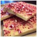Close-up of delicious white chocolate candy cane bark, topped with crushed candy canes.