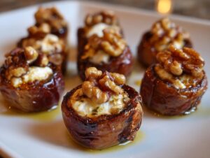 Close-up of several sweet and savory stuffed dates topped with creamy cheese and walnuts.