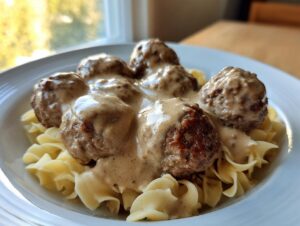 Five perfectly browned Swedish meatballs smothered in creamy brown gravy served over egg noodles.